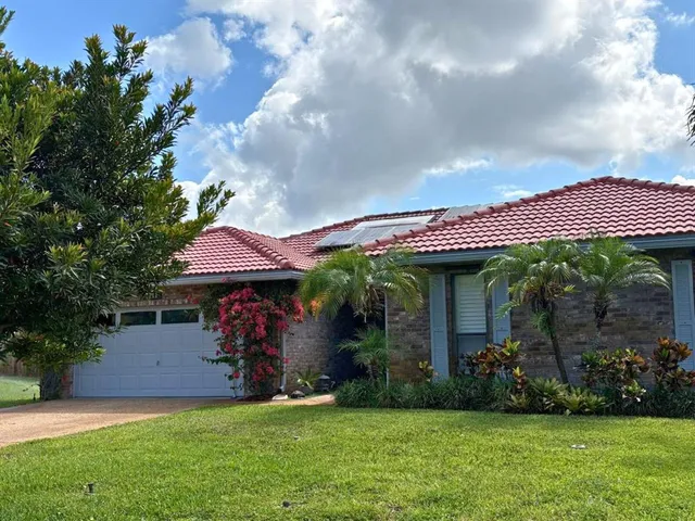 a view of a house with a garden