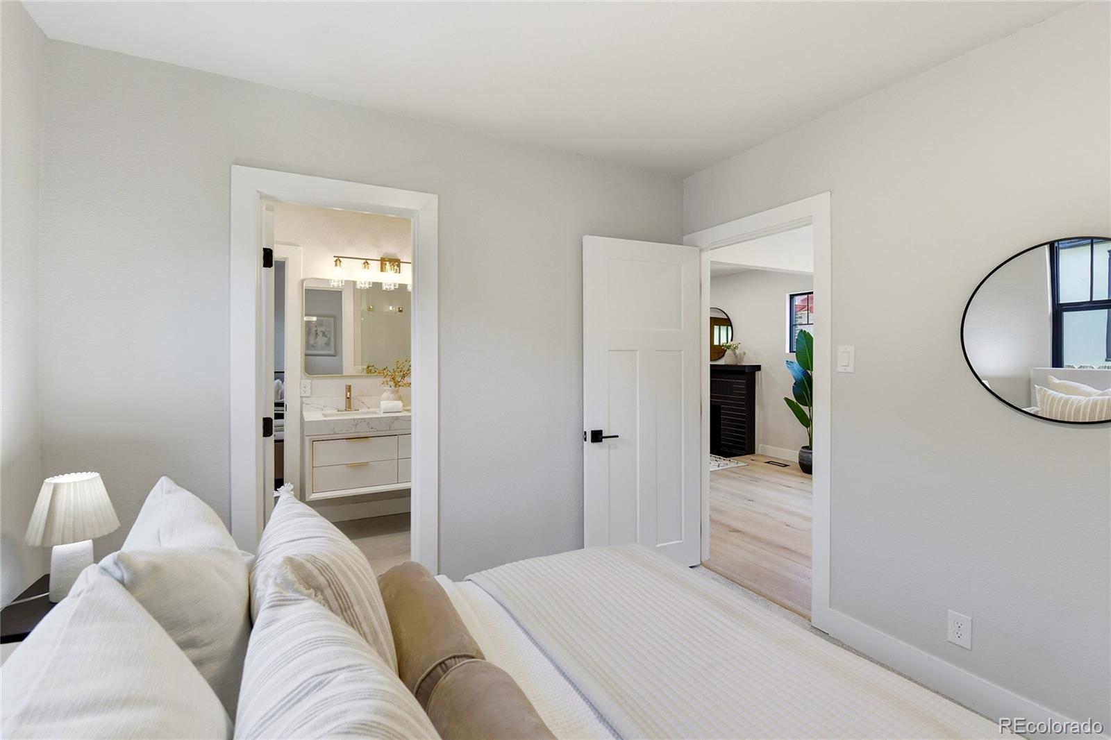 4545 Decatur Street Denver, CO 80211 - Photo 13 of 30 a bedroom with a bed and a mirror