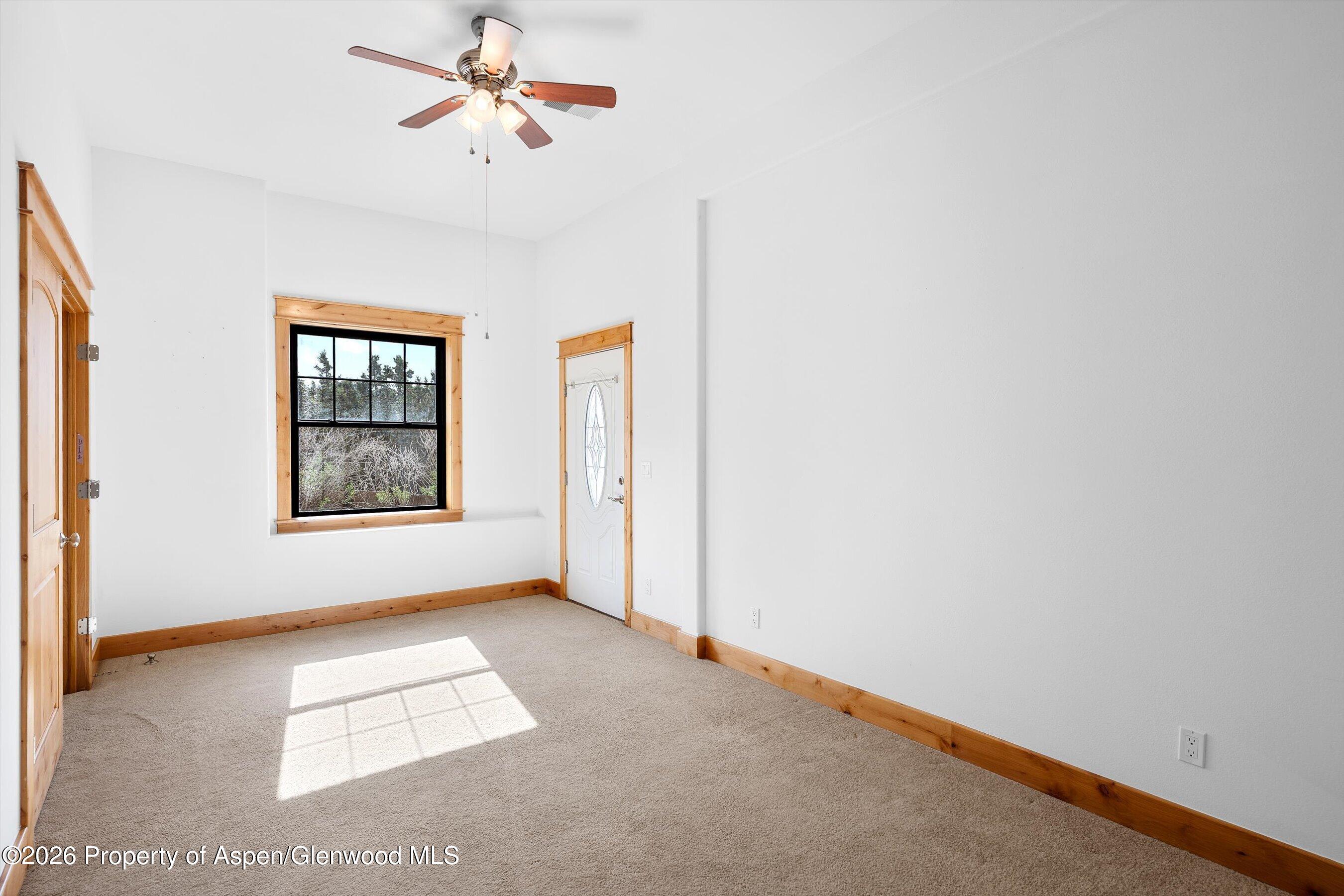 450 Summer Falls Road Silt, CO 81652 - Photo 27 of 50 an empty room with windows and fan