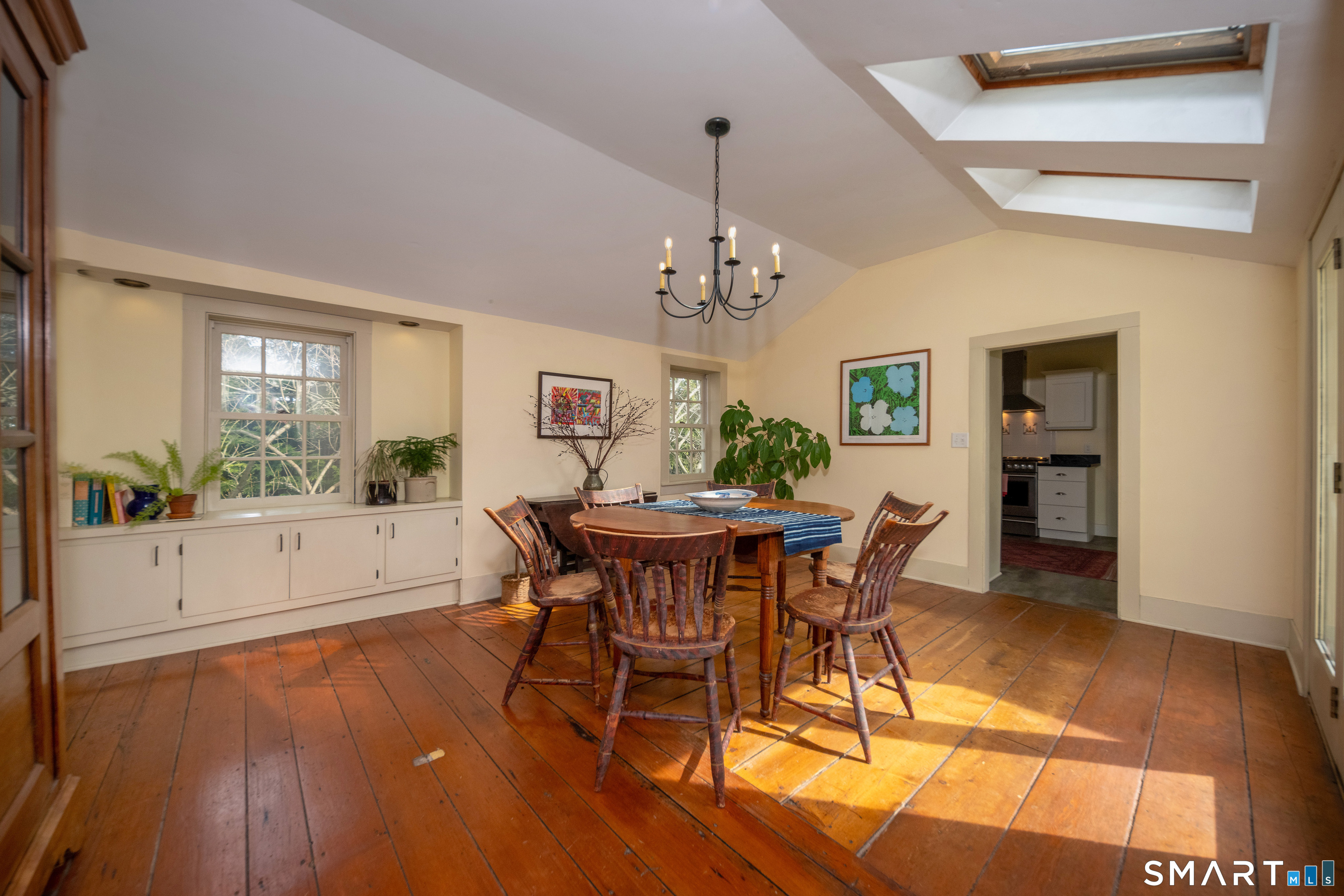 95 Fair Street Guilford, CT 06437 - Photo 11 of 40 a view of a dining room with furniture window and wooden floor