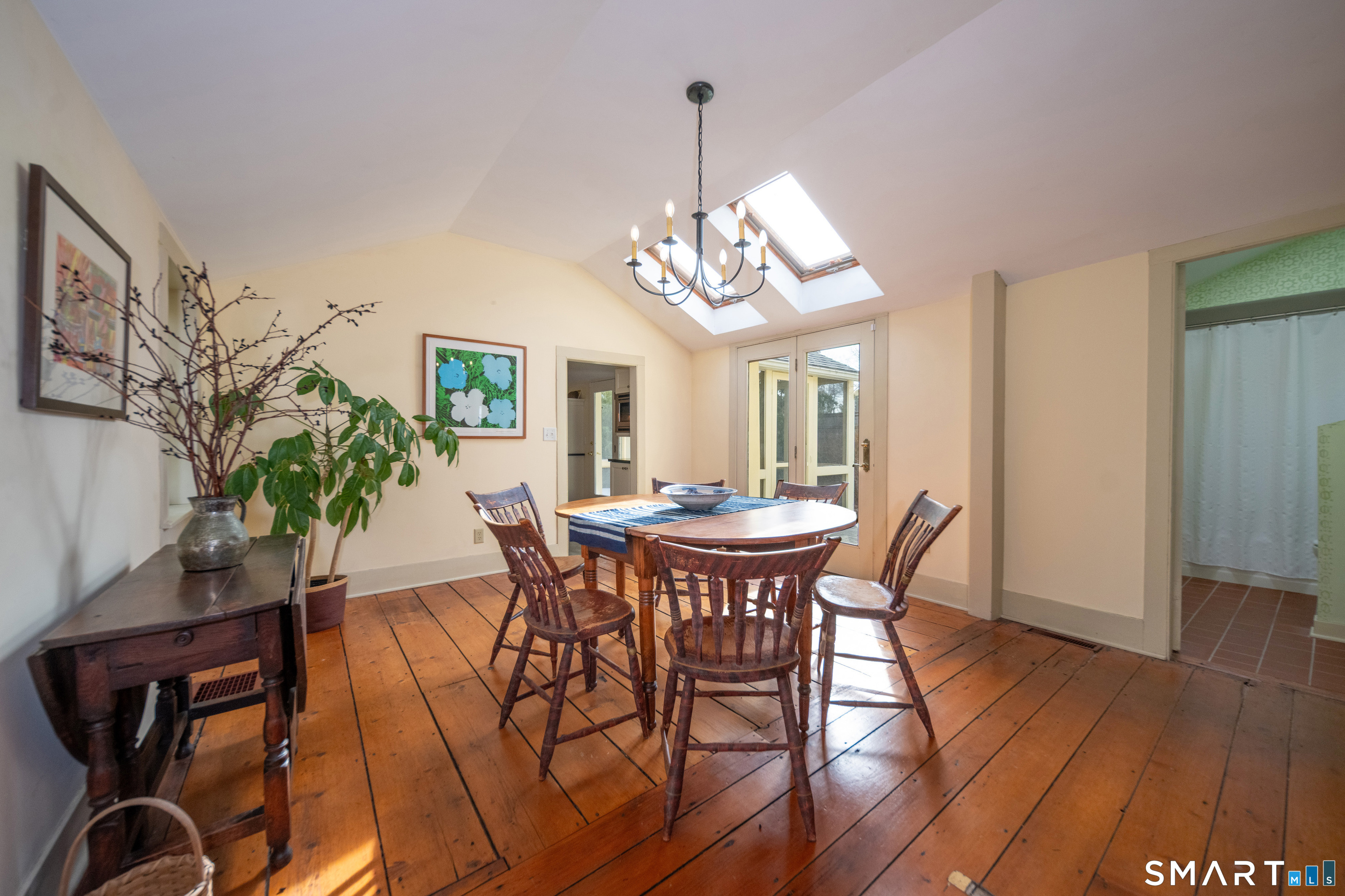 95 Fair Street Guilford, CT 06437 - Photo 12 of 40 a view of a dining room with furniture and wooden floor