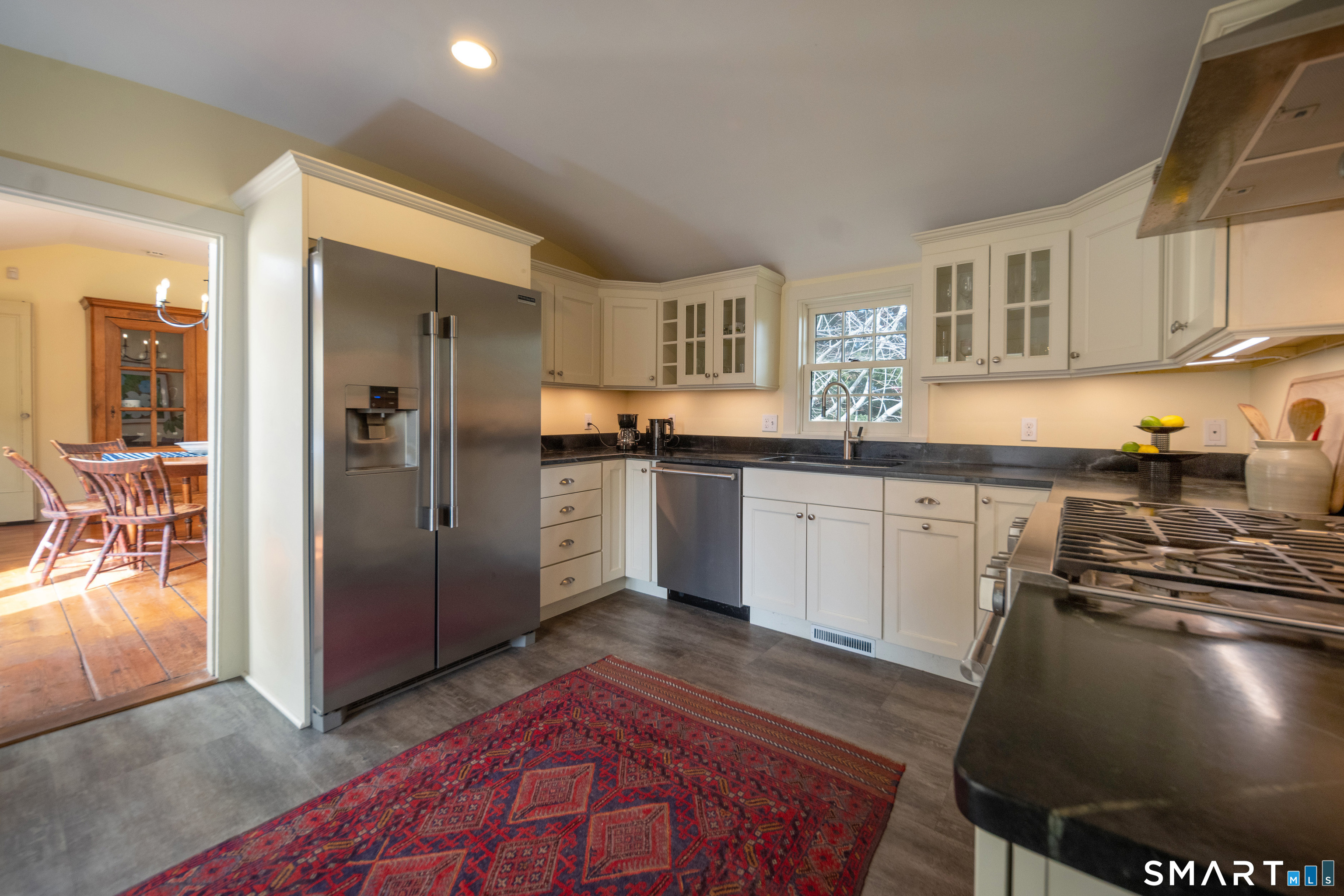 95 Fair Street Guilford, CT 06437 - Photo 14 of 40 a kitchen with stainless steel appliances granite countertop a sink stove and refrigerator