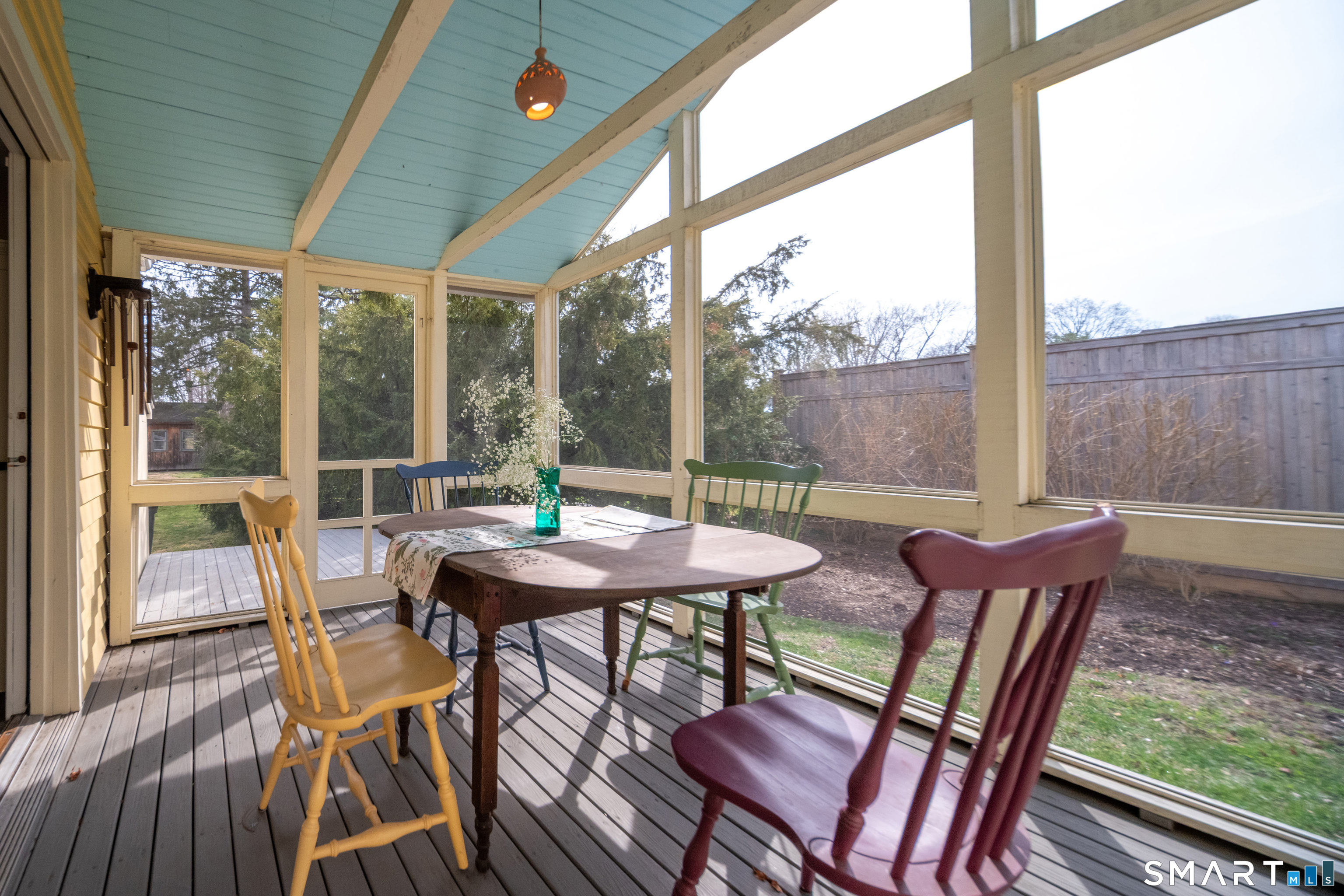 95 Fair Street Guilford, CT 06437 - Photo 17 of 40 a view of a patio with a table chairs and a potted plant