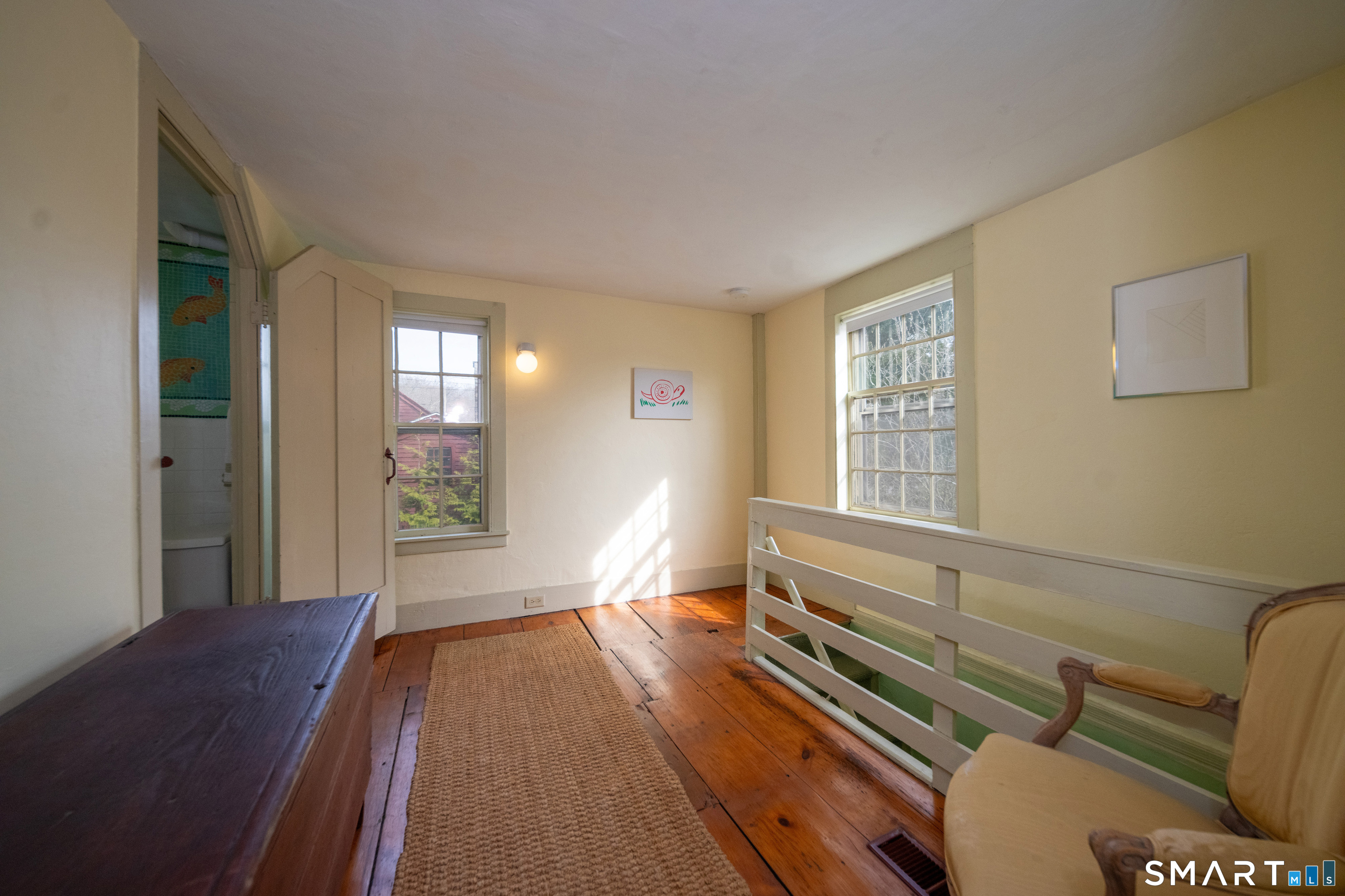 95 Fair Street Guilford, CT 06437 - Photo 26 of 40 a view of a room with furniture wooden floor and windows