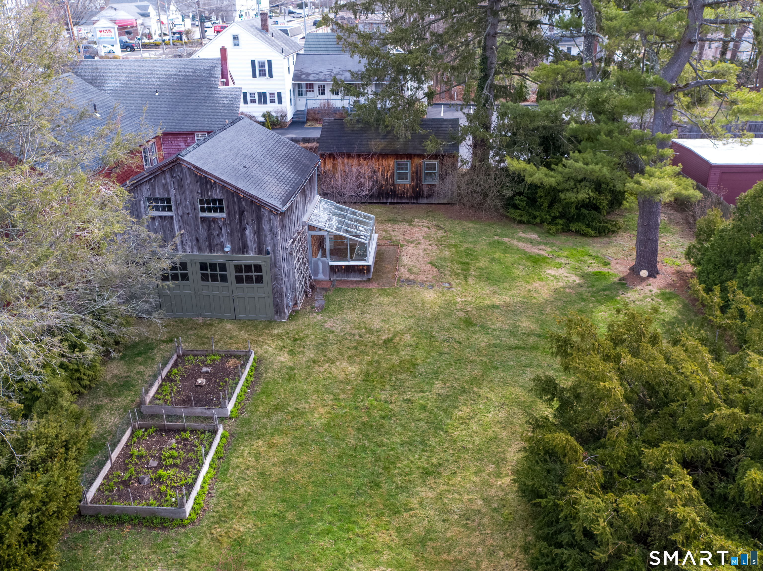 95 Fair Street Guilford, CT 06437 - Photo 33 of 40 an aerial view of a house with yard swimming pool and lake view