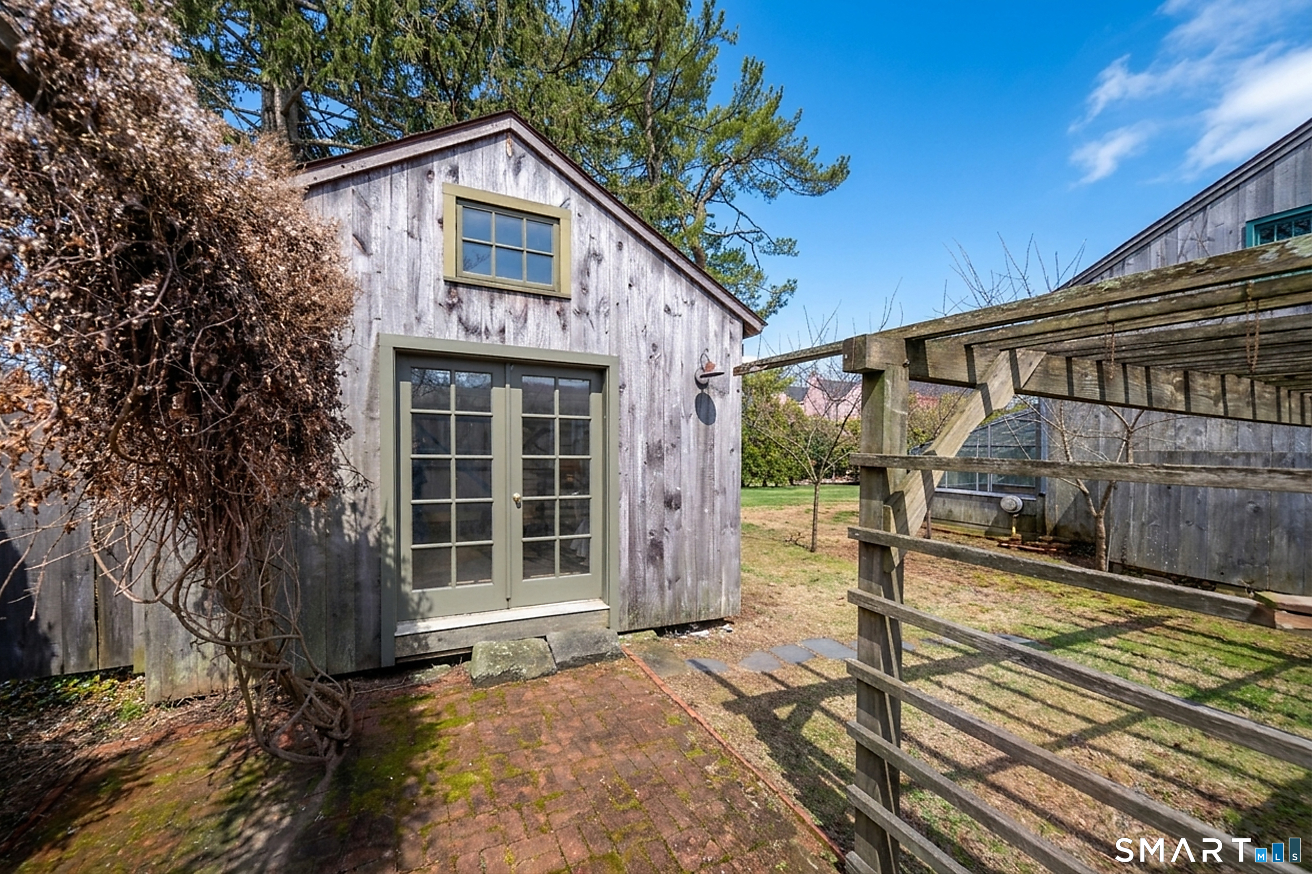 95 Fair Street Guilford, CT 06437 - Photo 34 of 40 a front view of a house with a garden