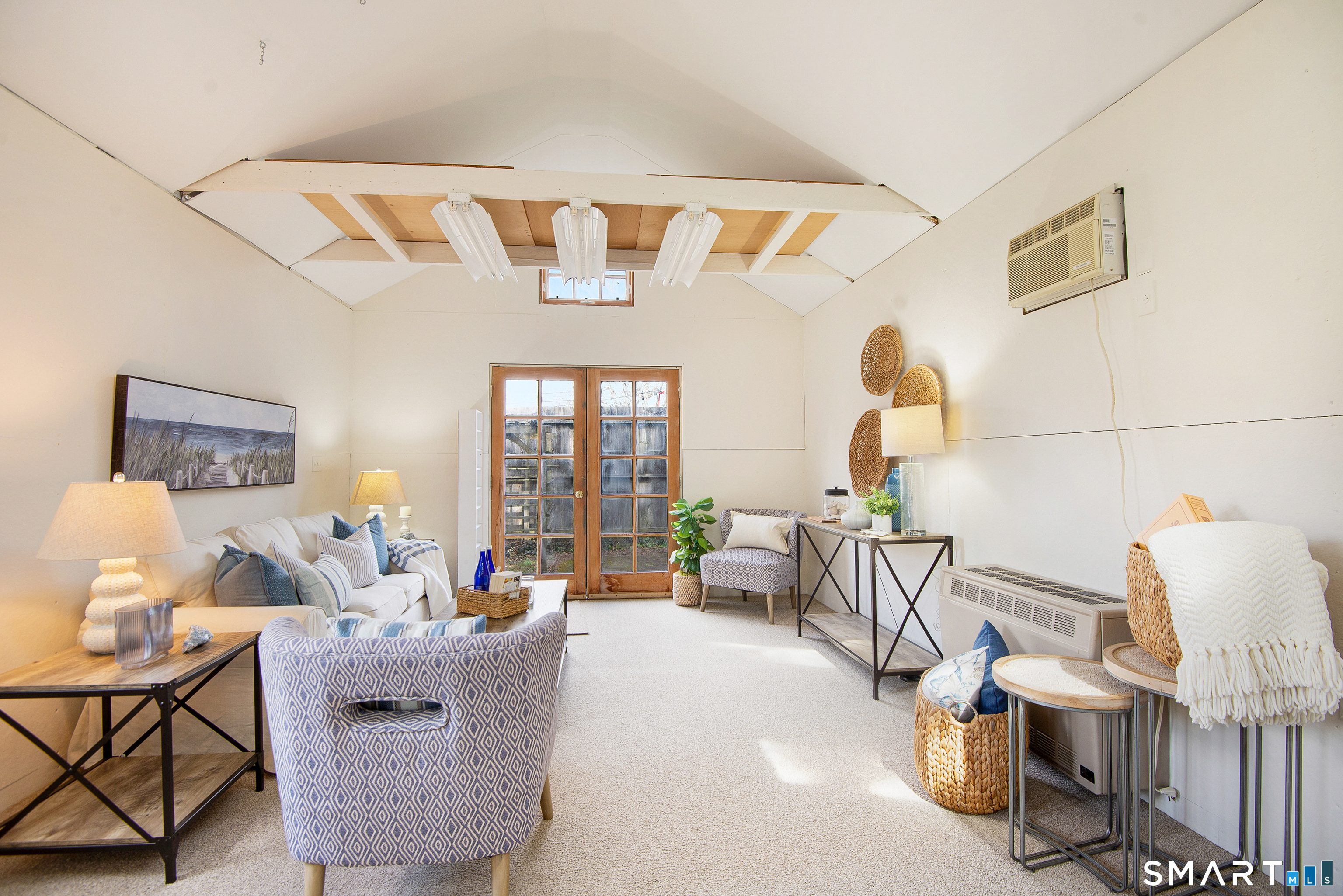 95 Fair Street Guilford, CT 06437 - Photo 36 of 40 a living room with furniture and a large window