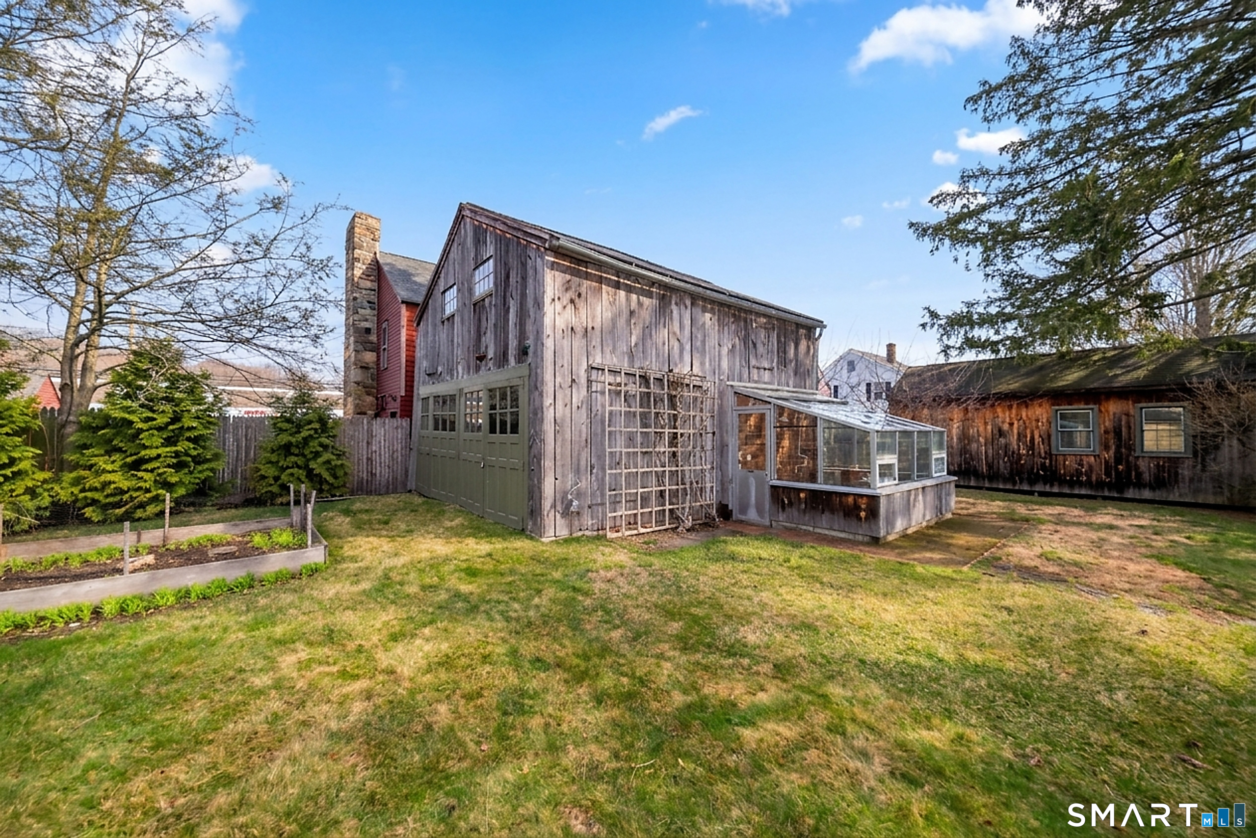 95 Fair Street Guilford, CT 06437 - Photo 39 of 40 a view of a house with backyard and sitting area