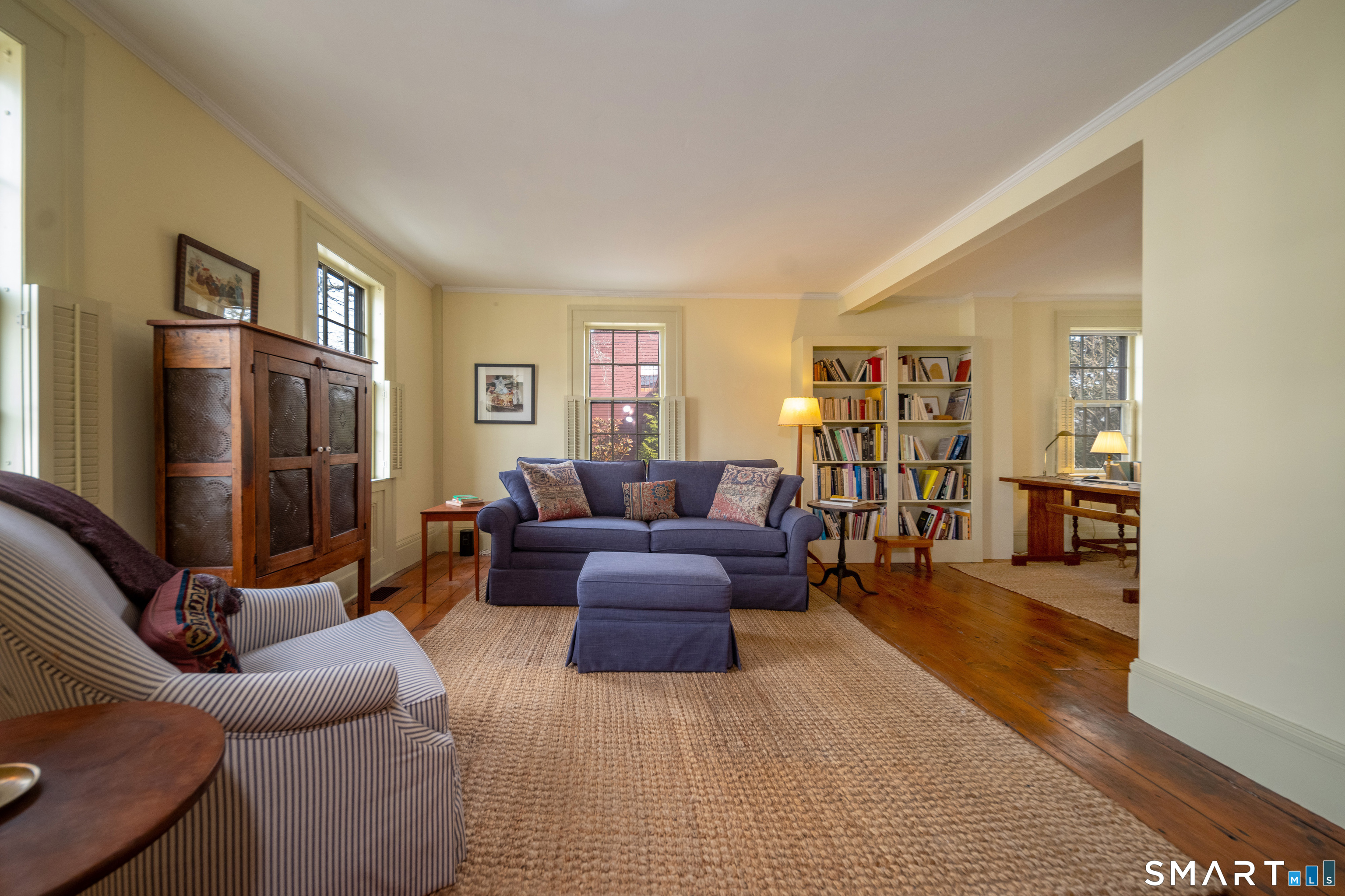 95 Fair Street Guilford, CT 06437 - Photo 5 of 40 a living room with furniture and a flat screen tv
