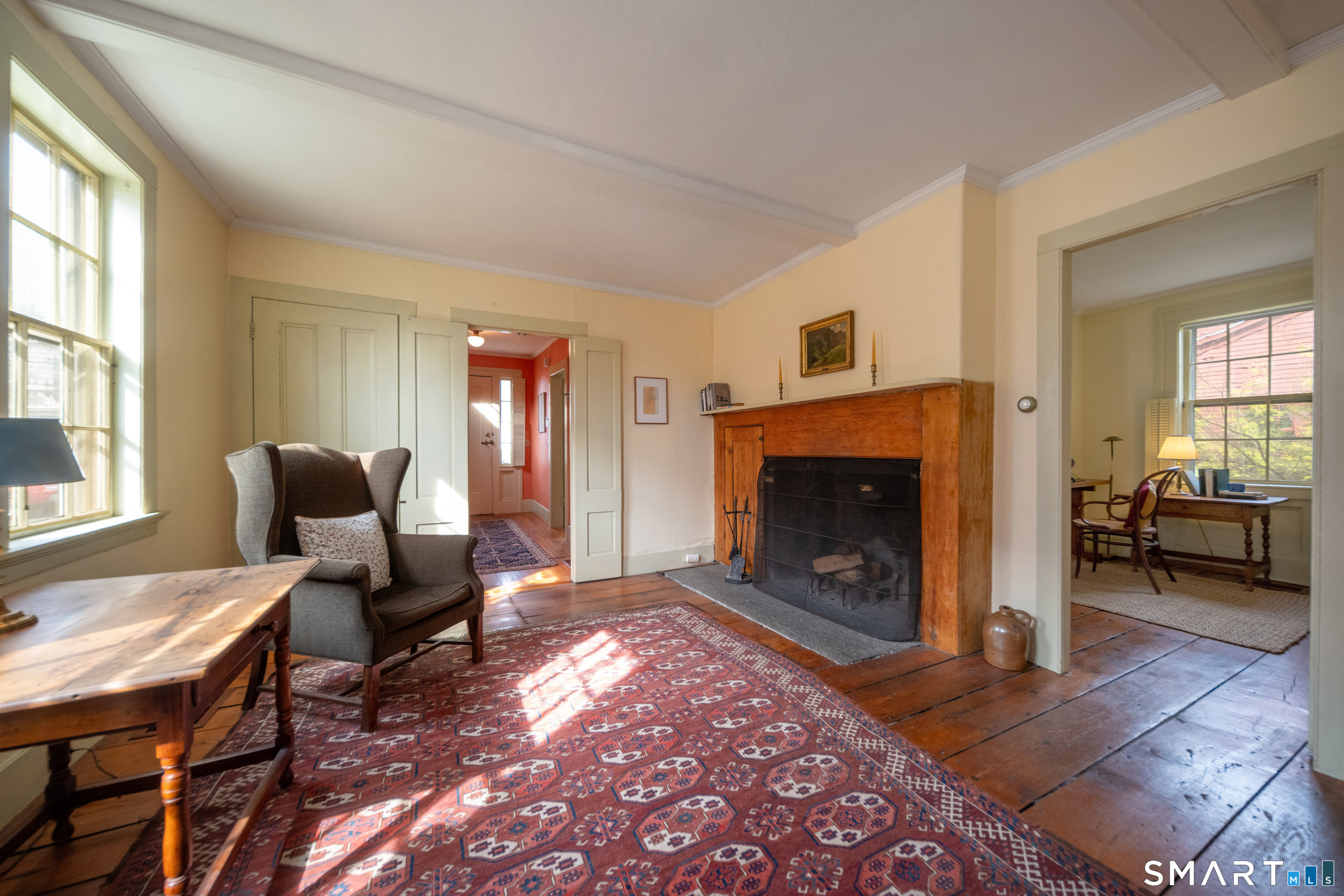 95 Fair Street Guilford, CT 06437 - Photo 8 of 40 a living room with furniture and a fireplace
