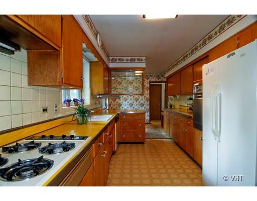 447 Uvedale Court Riverside, IL 60546 - Photo 8 of 12 a kitchen with sink cabinets and a stove