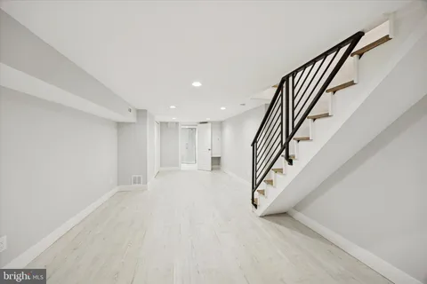 an entryway in hall with staircase