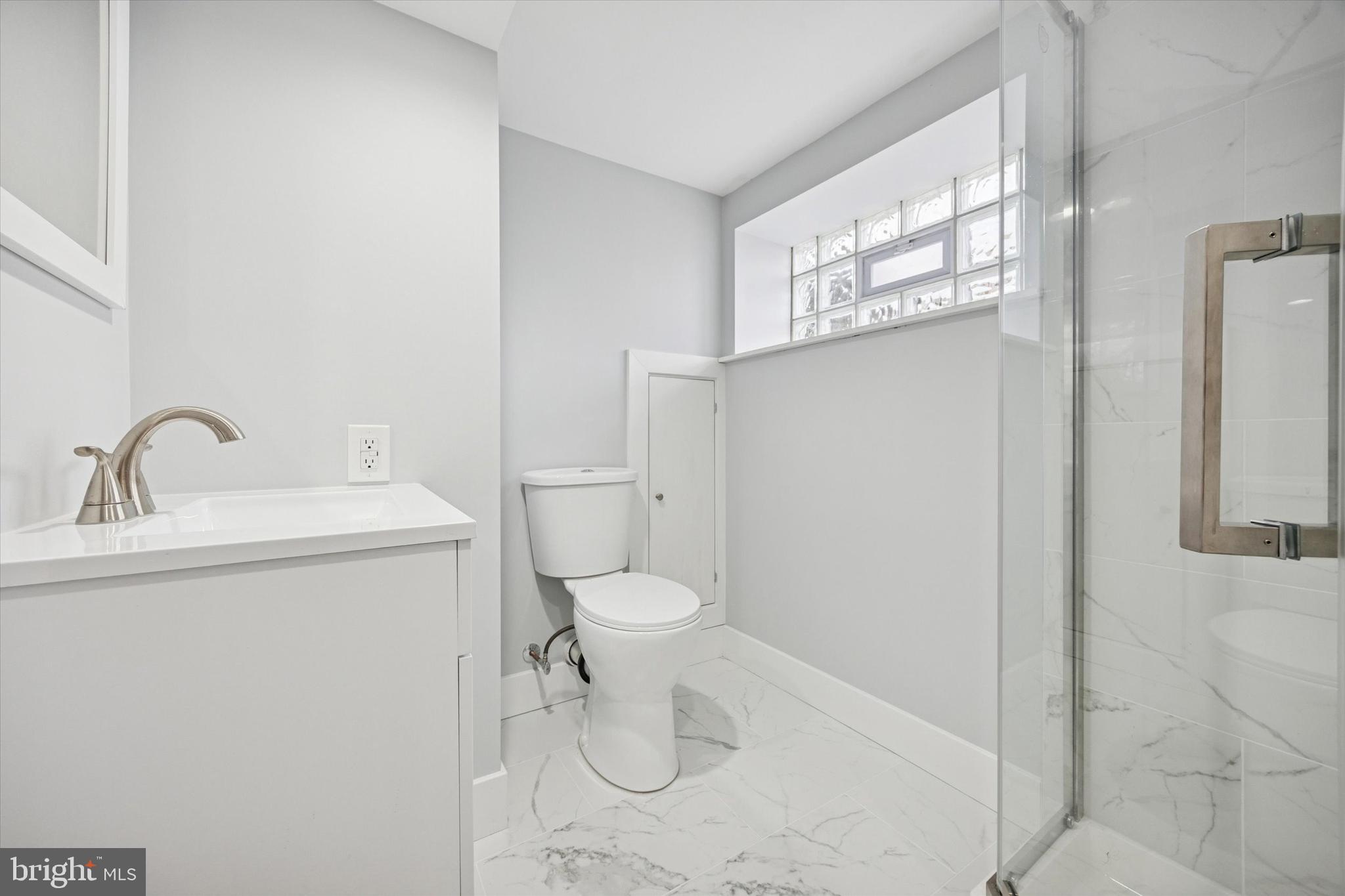 2869 Aramingo Avenue Philadelphia, PA 19134 - Photo 24 of 25 a bathroom with a toilet sink and mirror