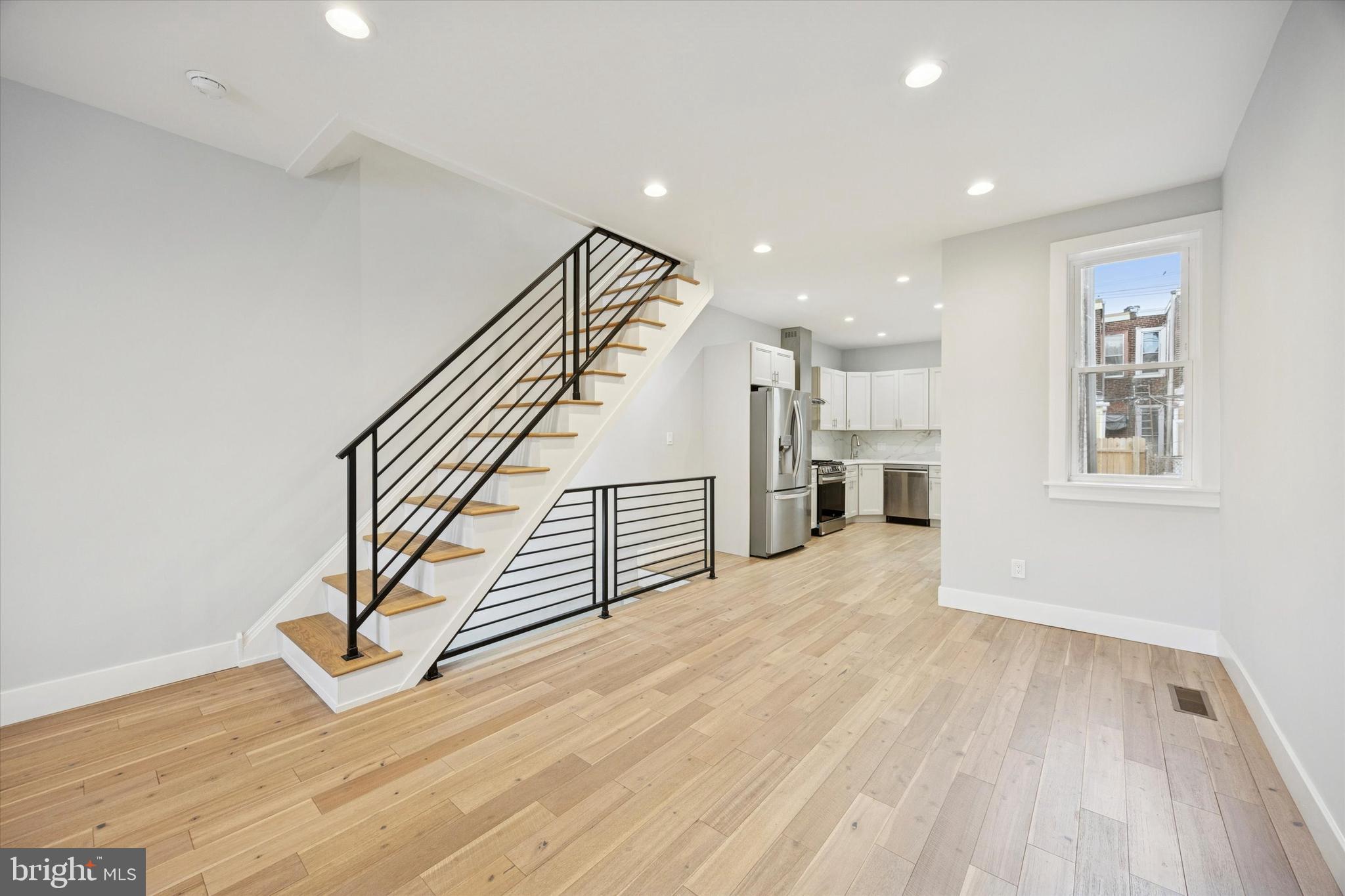 2869 Aramingo Avenue Philadelphia, PA 19134 - Photo 7 of 25 a view of entryway and hall with wooden floor