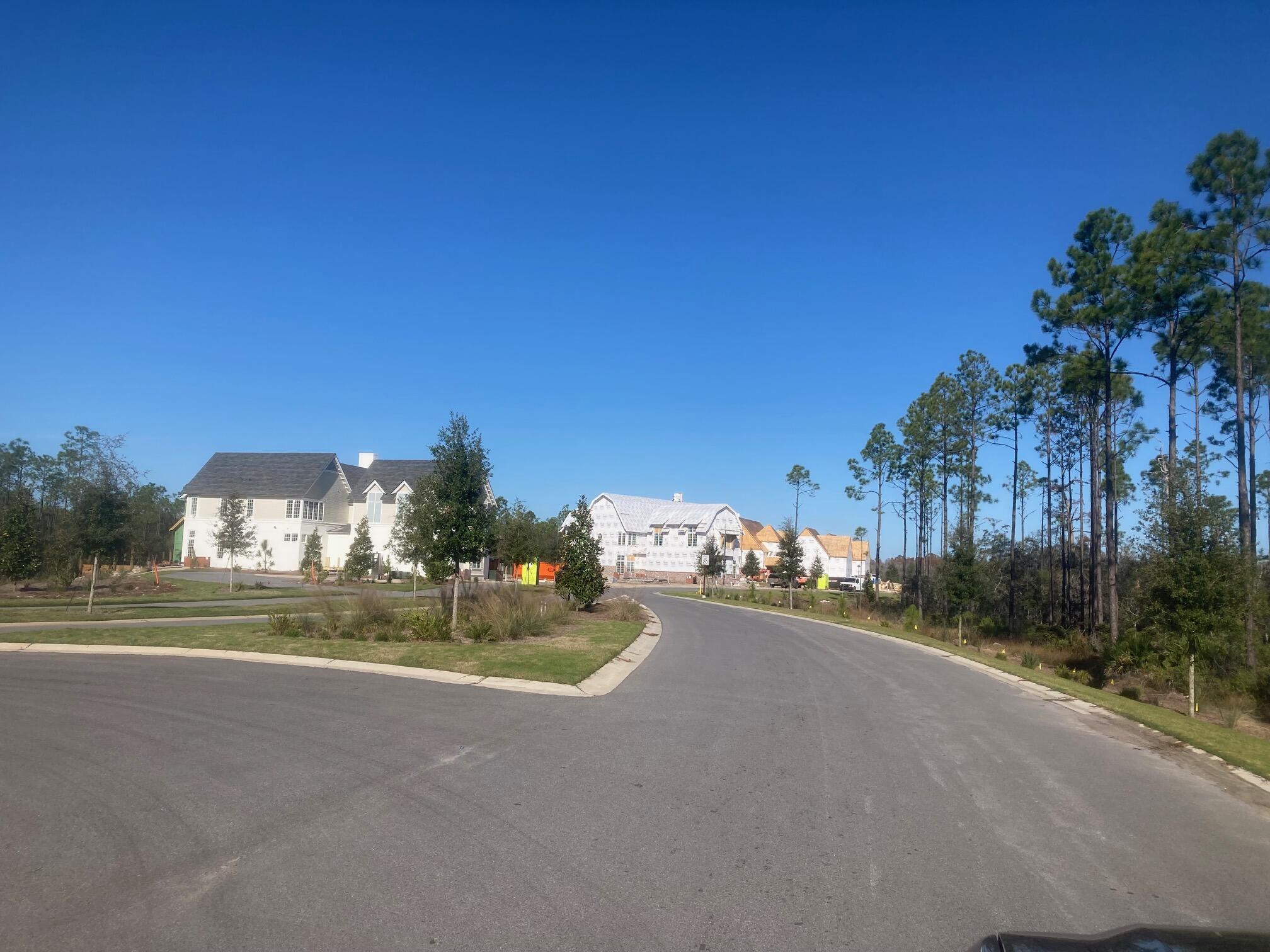 Lot 13 Golfridge Drive Watersound, FL 32461 - Photo 6 of 14 a view of a road with a cars parked in front of it