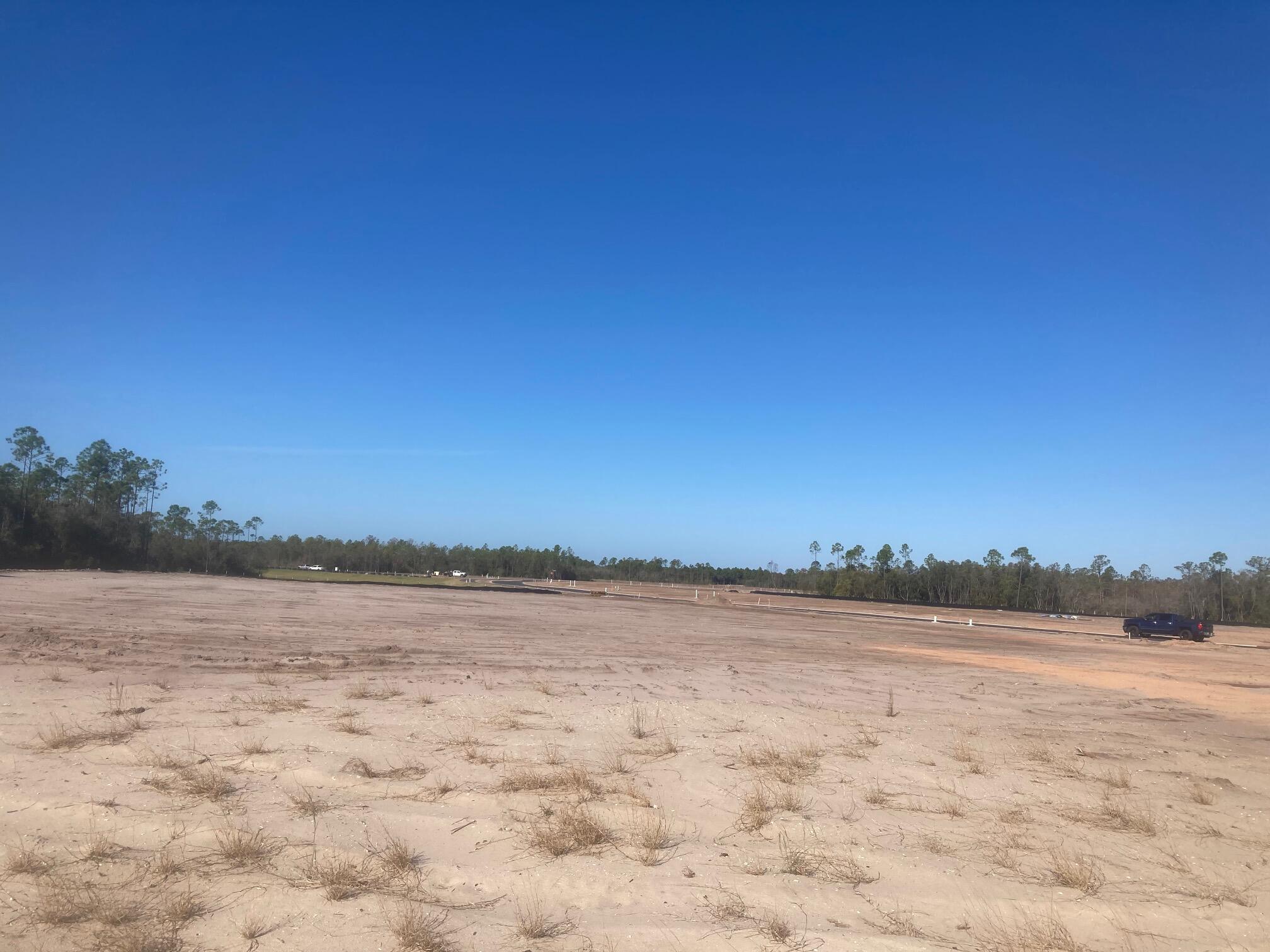 Lot 13 Golfridge Drive Watersound, FL 32461 - Photo 8 of 14 a view of lake and sunset