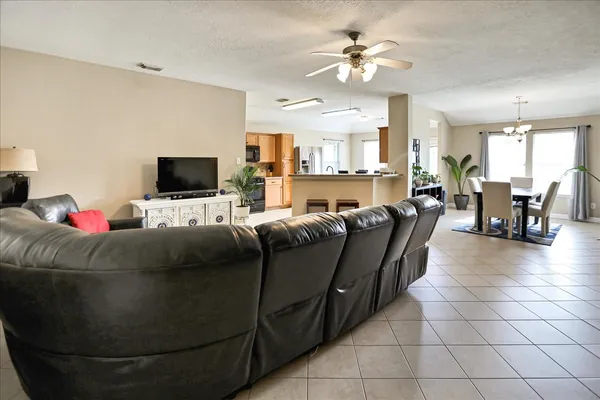 a living room with furniture bathtub and a potted plant