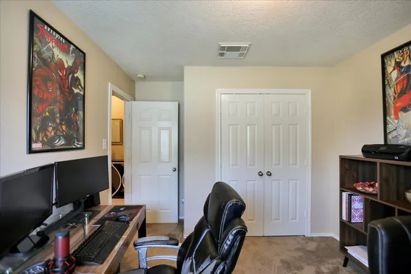 a bathroom with a toilet and a shower curtain