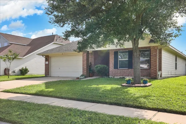 a front view of a house with a yard porch and patio