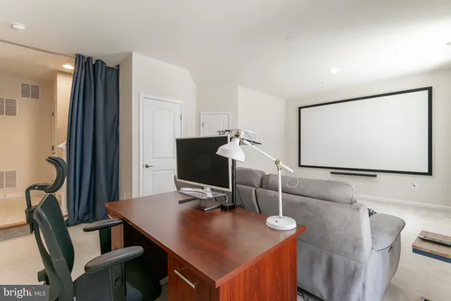 a view of a workspace with furniture