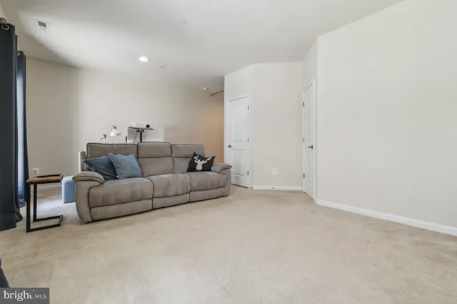a living room with furniture and a couch