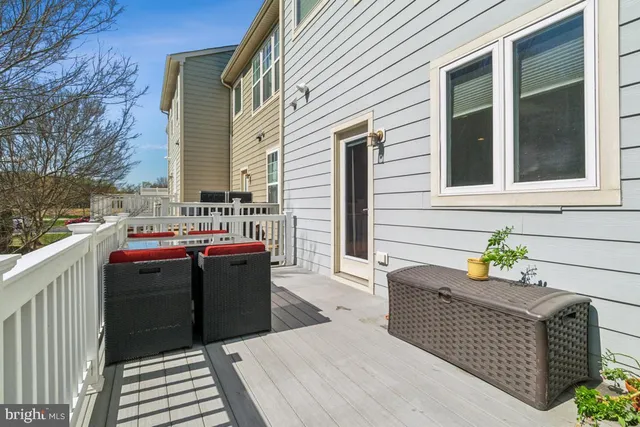 a view of a patio with a table and chairs