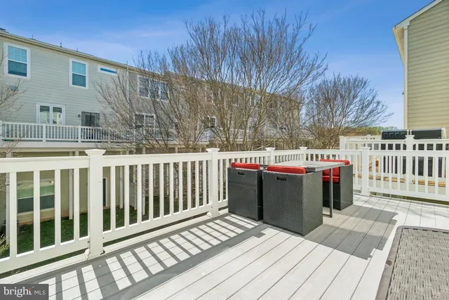 a view of a balcony with wooden floor
