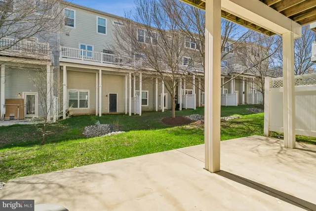 a view of a brick house with a large windows