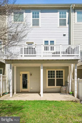 a view of a house with a yard and sitting space