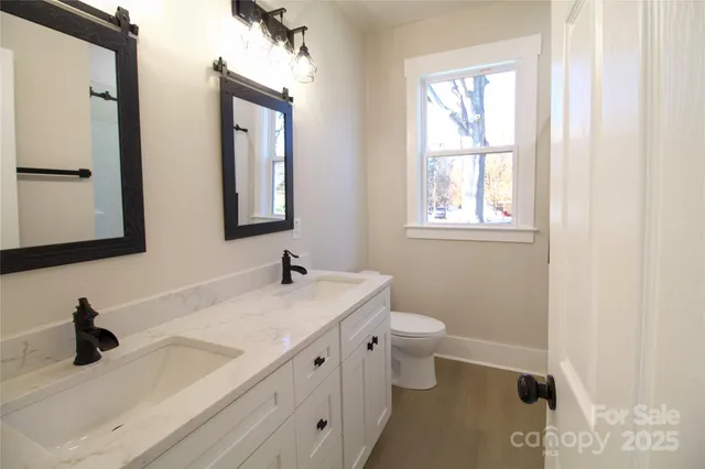 a picture of a bathroom with a shower