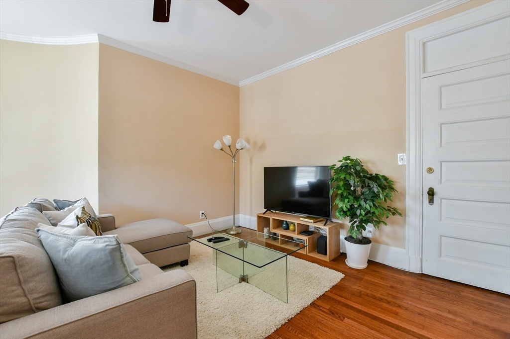 1091 Boylston Street, Unit 31 Boston, MA 02215 - Photo 11 of 14 a living room with furniture and a flat screen tv