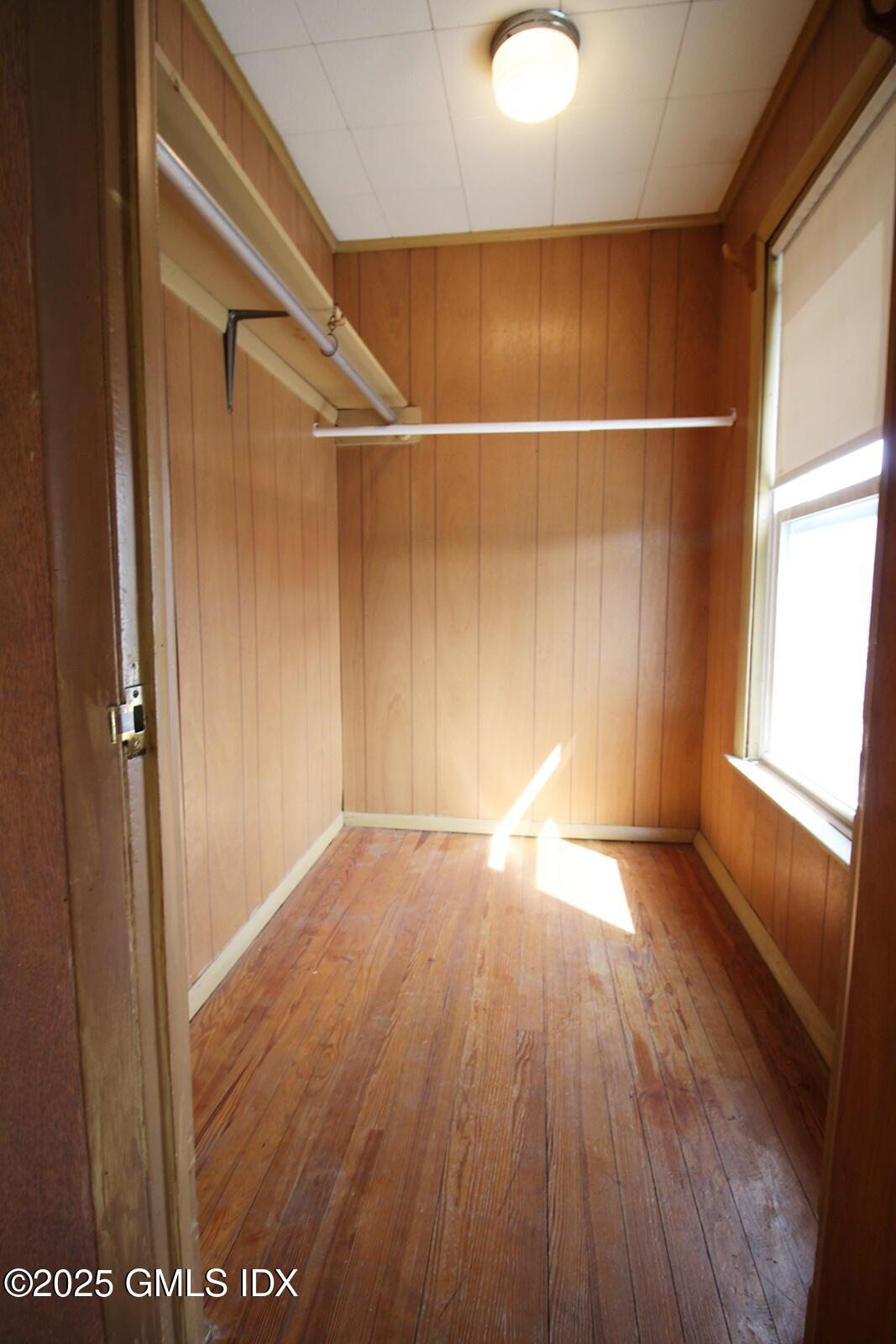 18 Harold Avenue, Unit B Greenwich, CT 06830 - Photo 7 of 9 a view of an empty room with wooden floor and a window