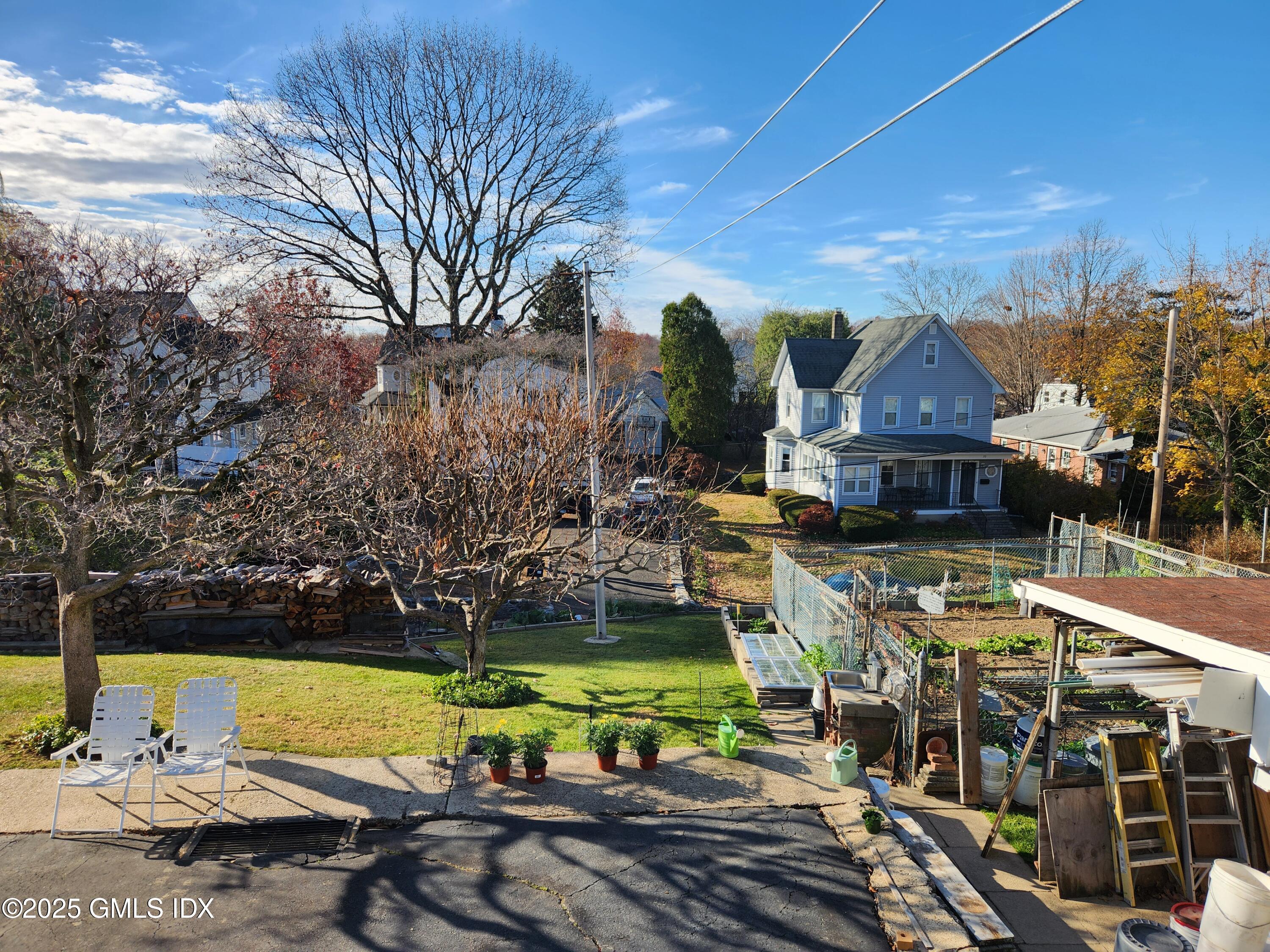 18 Harold Avenue, Unit B Greenwich, CT 06830 - Photo 8 of 9 a view of a house with garden space and sitting area