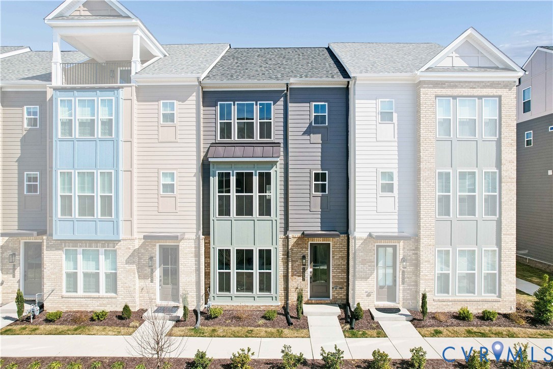 12042 Flowering Lavender Loop Henrico, VA 23233 - Photo 2 of 46 a front view of a building with street view