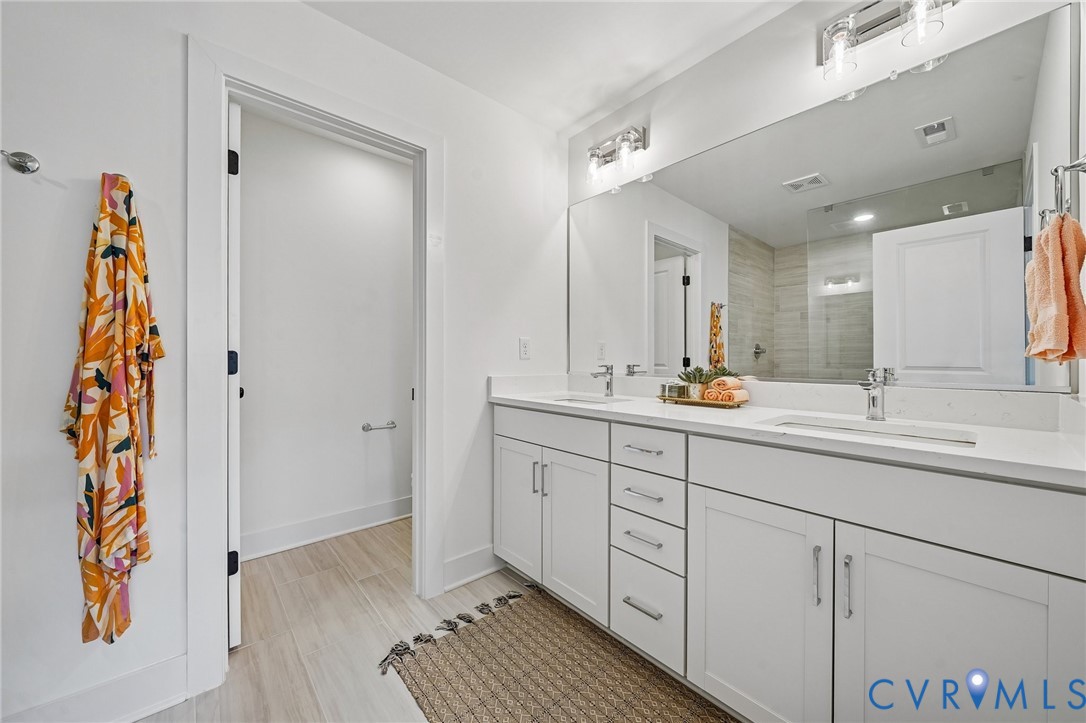 12042 Flowering Lavender Loop Henrico, VA 23233 - Photo 25 of 46 a bathroom with a sink and a mirror