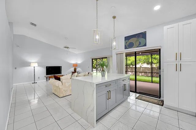 a spacious bathroom with a double vanity sink mirror and double