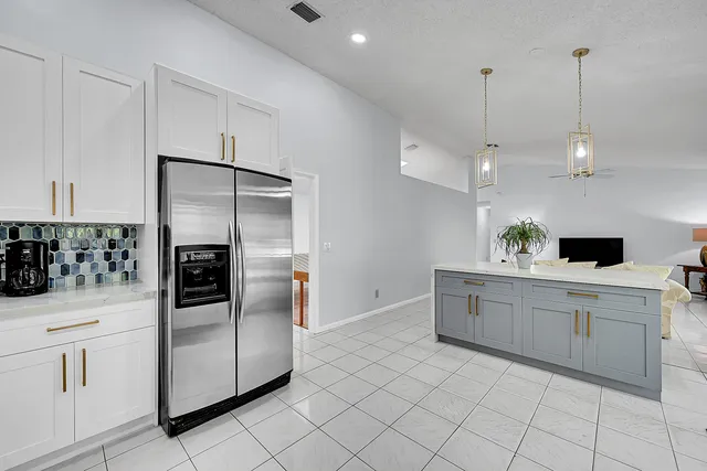 a view of an empty room with a ceiling fan