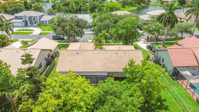 a kitchen with stainless steel appliances a counter space cabinets and a fireplace