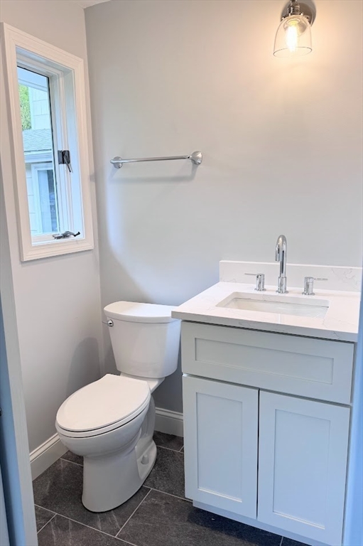 9 Poskus Road Framingham, MA 01701 - Photo 11 of 36 a bathroom with a sink toilet and vanity