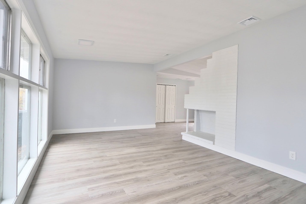 9 Poskus Road Framingham, MA 01701 - Photo 15 of 36 a view of an empty room with wooden floor and a window