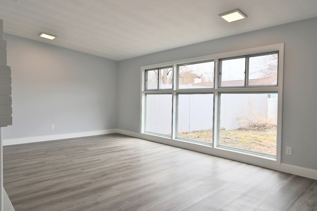 9 Poskus Road Framingham, MA 01701 - Photo 16 of 36 wooden floor in an empty room with a window