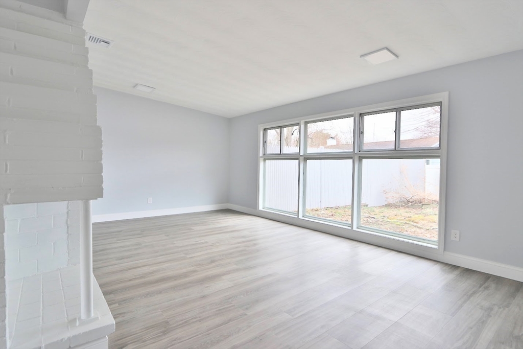 9 Poskus Road Framingham, MA 01701 - Photo 17 of 36 an empty room with wooden floor and windows