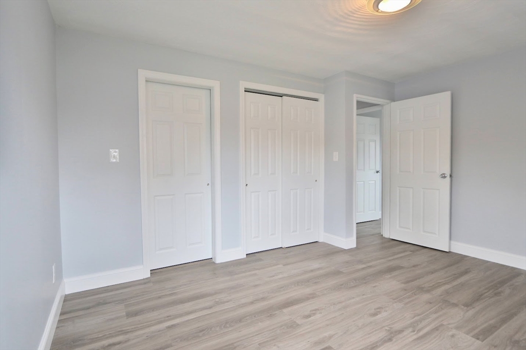 9 Poskus Road Framingham, MA 01701 - Photo 21 of 36 a view of an empty room with wooden floor
