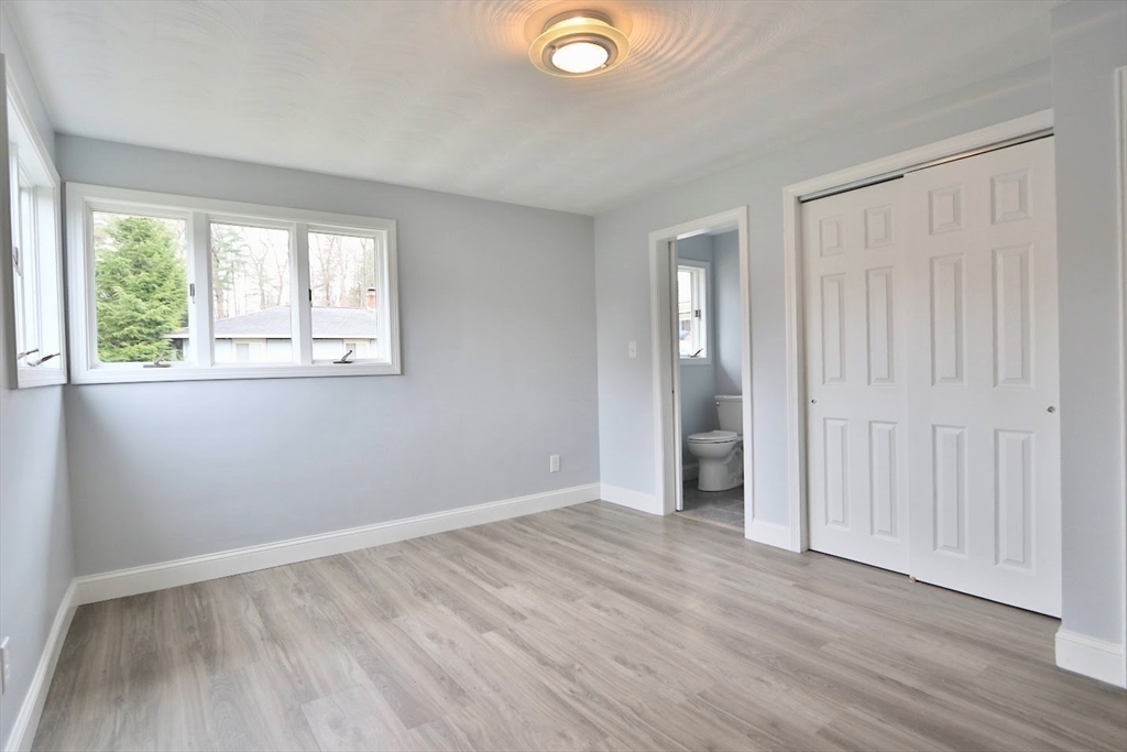 9 Poskus Road Framingham, MA 01701 - Photo 22 of 36 an empty room with wooden floor and windows