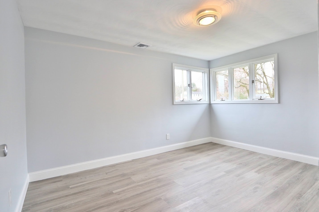 9 Poskus Road Framingham, MA 01701 - Photo 23 of 36 wooden floor in an empty room with a window