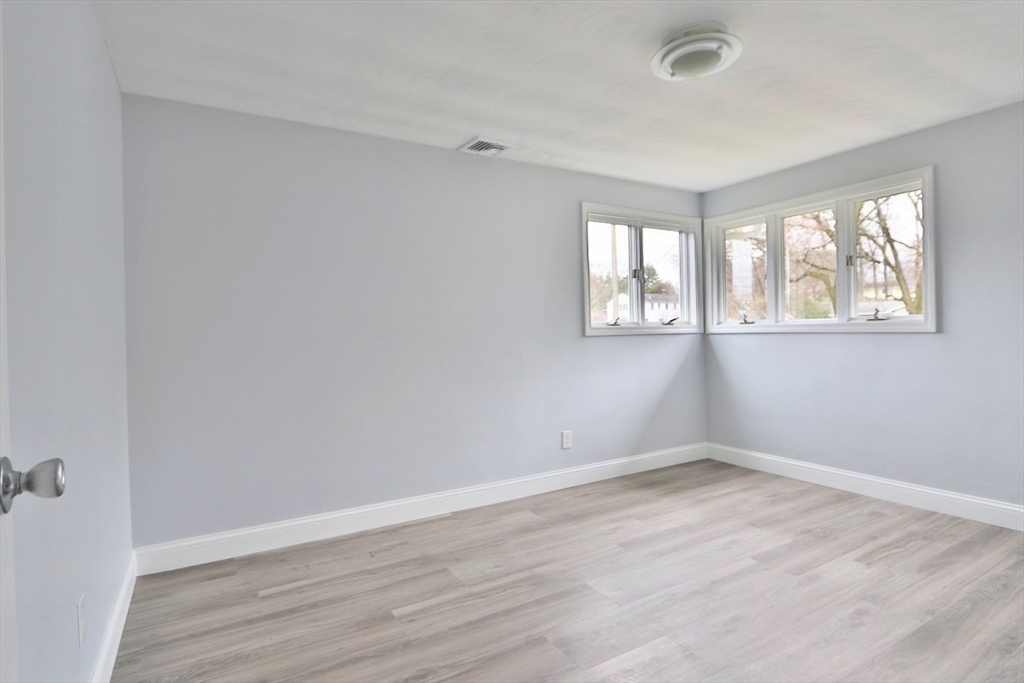 9 Poskus Road Framingham, MA 01701 - Photo 24 of 36 an empty room with wooden floor and windows