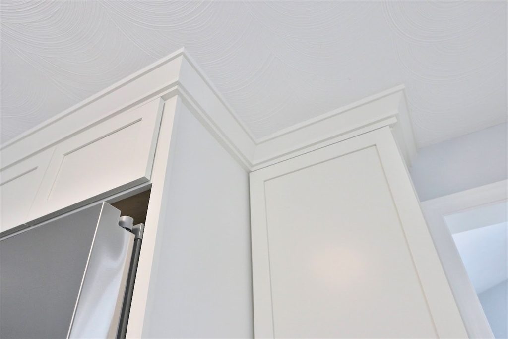 9 Poskus Road Framingham, MA 01701 - Photo 27 of 36 a view of staircase with white walls and white door