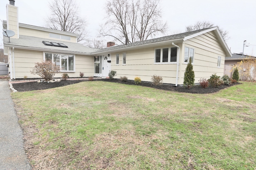 9 Poskus Road Framingham, MA 01701 - Photo 28 of 36 a view of a white house with a big yard and large trees