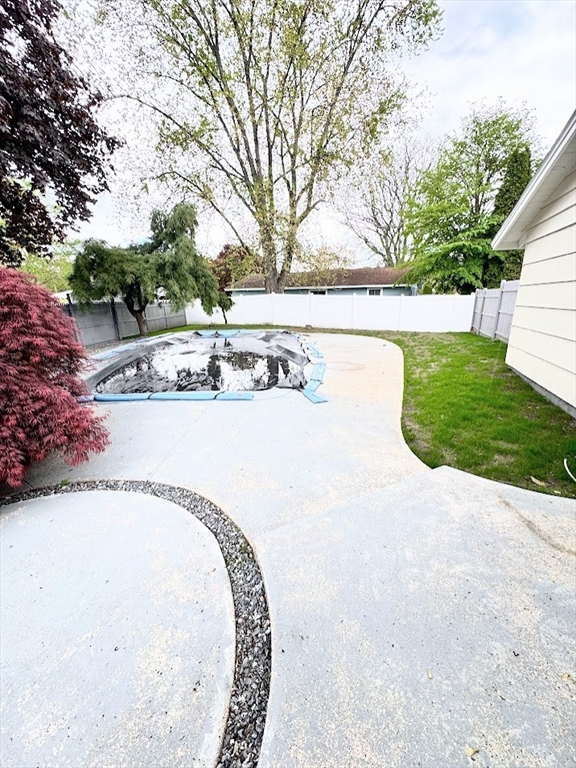 9 Poskus Road Framingham, MA 01701 - Photo 35 of 36 a view of a swimming pool with a yard