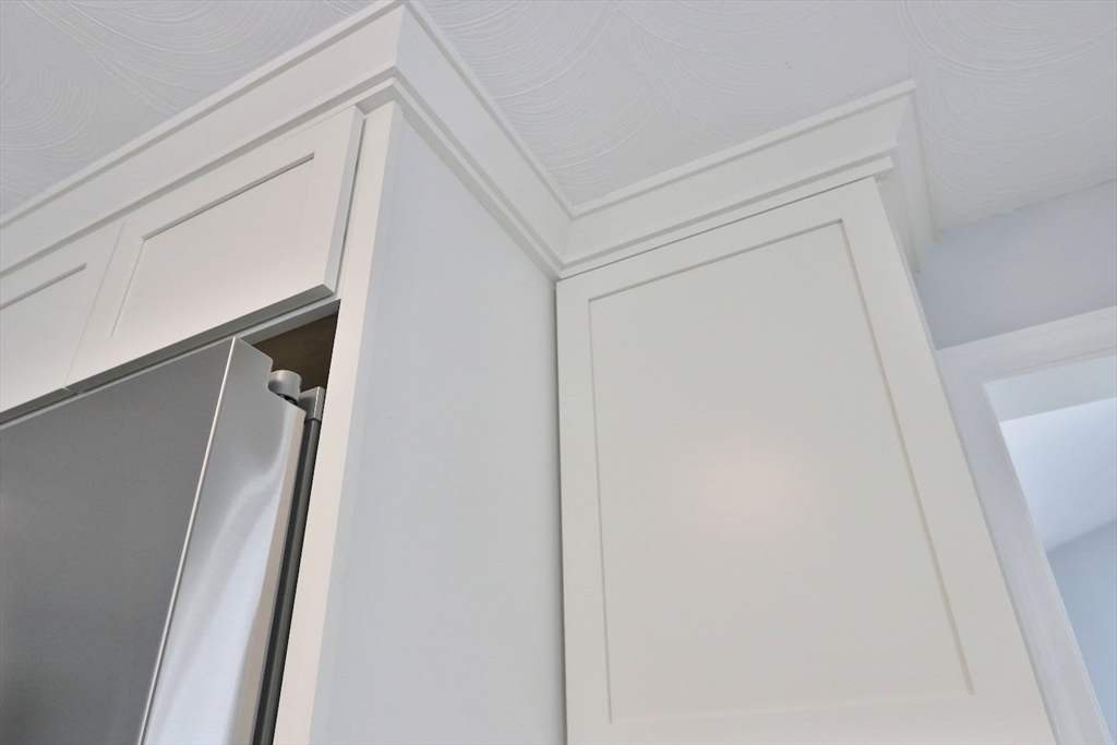 9 Poskus Road Framingham, MA 01701 - Photo 6 of 36 a view of staircase with railing and white walls